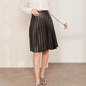J. Crew Black Faux-leather sunburst pleated midi skirt size 2
Item B5275